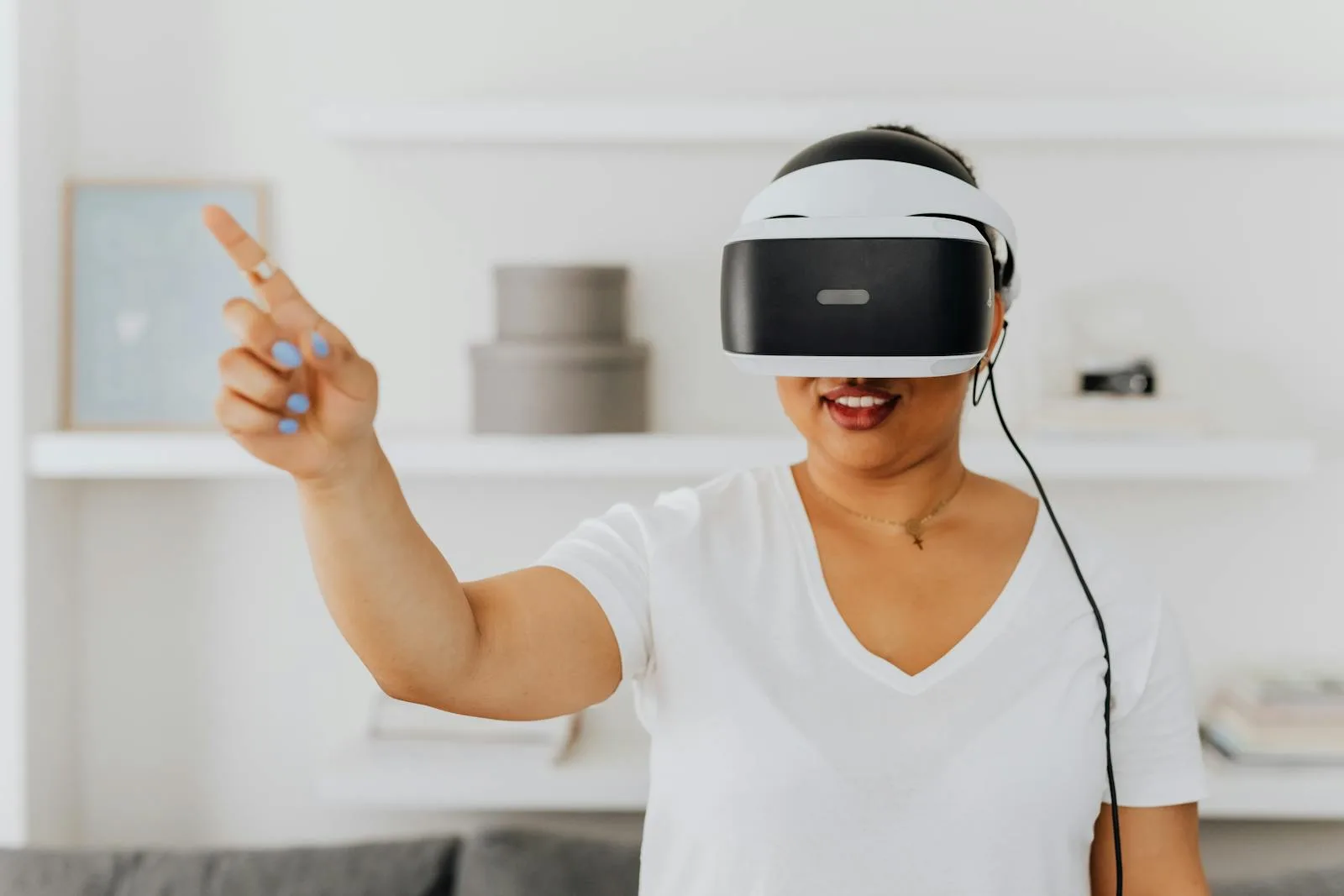 Woman using a VR headset for augmented reality interaction, gesturing while immersed in virtual environment.